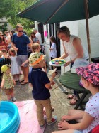 Winning a prize at the hook-a-duck